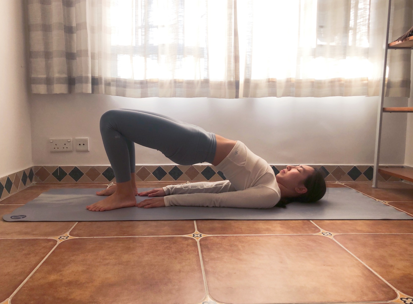 Bridge Pose with hips lifted off the mat
