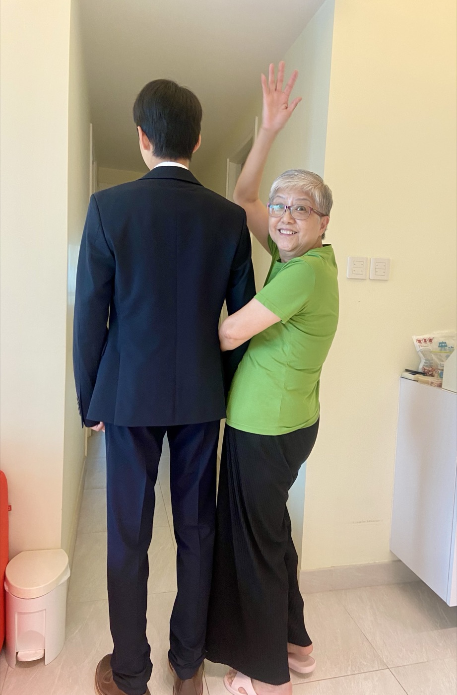 A coach supporting an older client during her recovery
